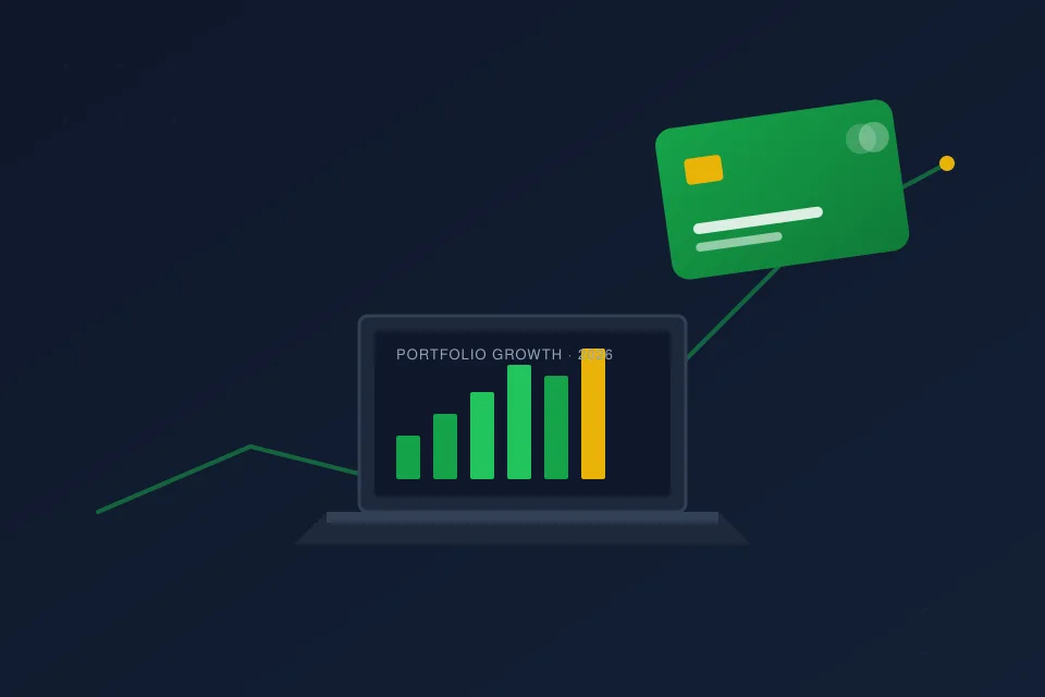 Modern American financial advisory office desk with a laptop displaying an upward-trending portfolio growth chart alongside a premium emerald cashback rewards credit card, representing expert personal finance guidance for credit cards, savings, and wealth building in 2026